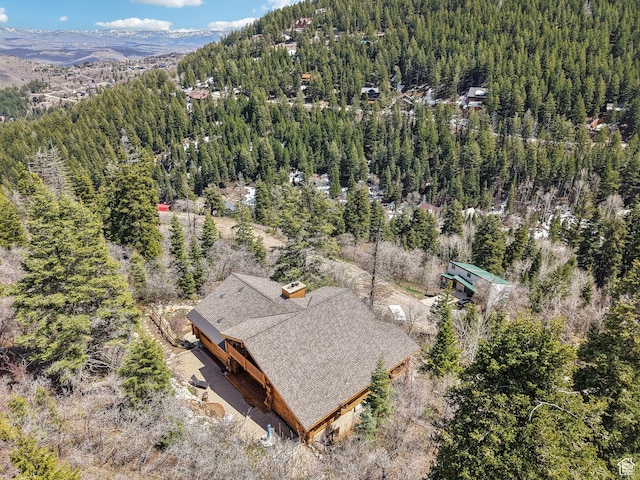drone / aerial view with a view of trees