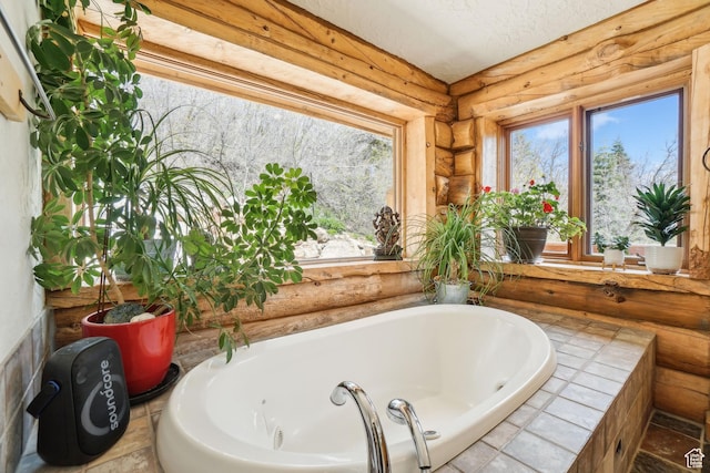 full bath featuring a garden tub and rustic walls