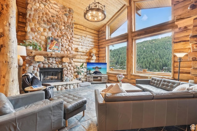 living room featuring wooden ceiling, a stone fireplace, rustic walls, an inviting chandelier, and high vaulted ceiling