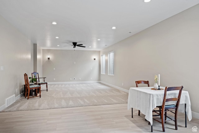 dining room with baseboards, ceiling fan, light wood-style floors, and recessed lighting
