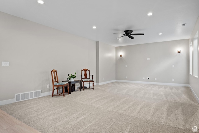 living area with visible vents, a ceiling fan, and recessed lighting
