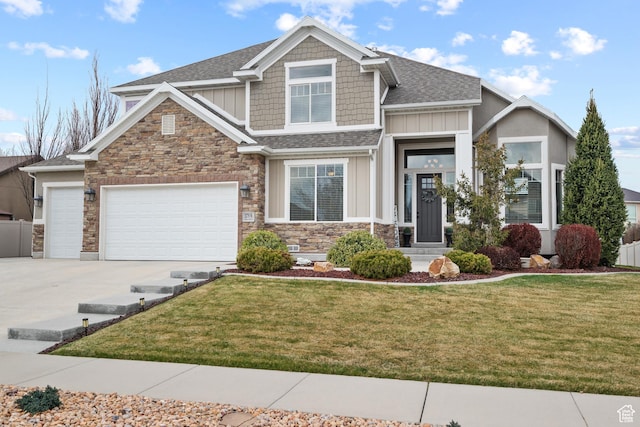 craftsman-style home with an attached garage, stone siding, concrete driveway, a front lawn, and board and batten siding