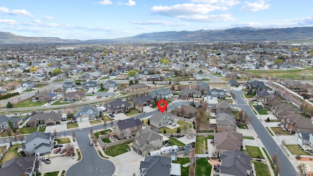 drone / aerial view featuring a mountain view and a residential view