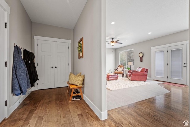 entrance foyer with ceiling fan, recessed lighting, baseboards, and wood finished floors
