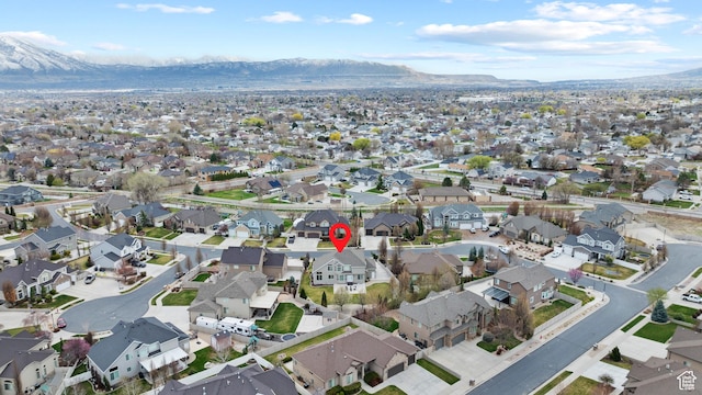 birds eye view of property featuring a mountain view and a residential view