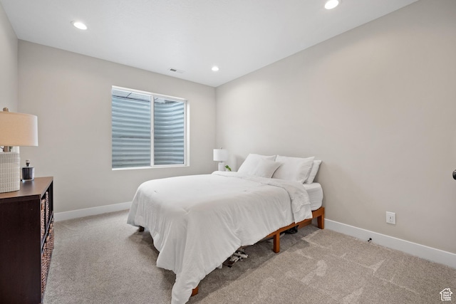 carpeted bedroom with baseboards, visible vents, and recessed lighting