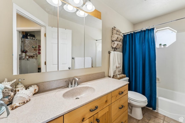 bathroom featuring toilet, shower / bath combo, and vanity