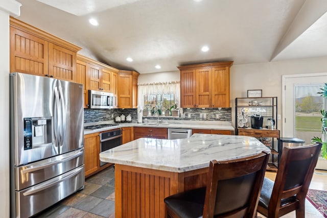 801 E 380 N Unit 57, Heber City, UT 84032 - kitchen featuring stainless steel appliances, tasteful backsplash, recessed lighting, dark stone finish floors, and a kitchen breakfast bar