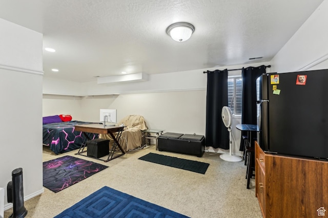 interior space featuring recessed lighting, a textured ceiling, baseboards, and carpet floors