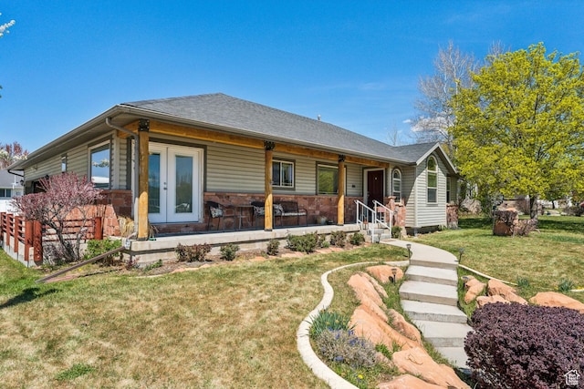 view of front facade with a porch and a front lawn