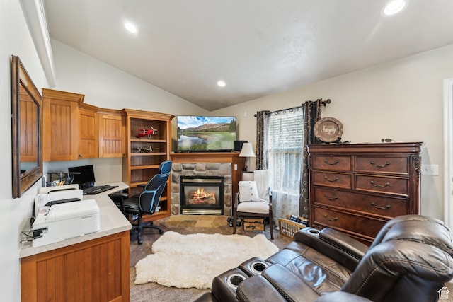 office area with a fireplace, recessed lighting, and vaulted ceiling