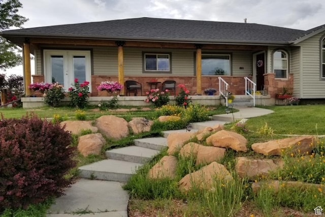 801 E 380 N Unit 57, Heber City, UT 84032 - view of front facade featuring covered porch, a front yard, and roof with shingles