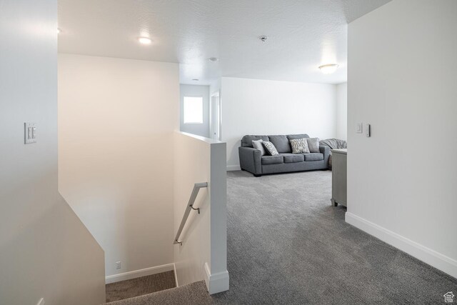 5740 Cardinal Wing Dr Unit 17, St George, UT 84790 - hallway with carpet flooring, baseboards, and an upstairs landing