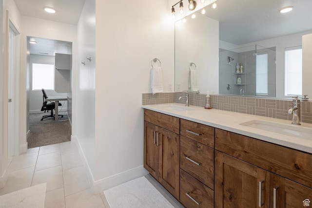 5740 Cardinal Wing Dr Unit 17, St George, UT 84790 - bathroom with a sink, double vanity, decorative backsplash, and a stall shower