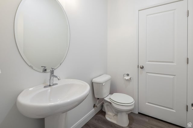 5740 Cardinal Wing Dr Unit 17, St George, UT 84790 - half bath with toilet, wood finished floors, baseboards, and a sink