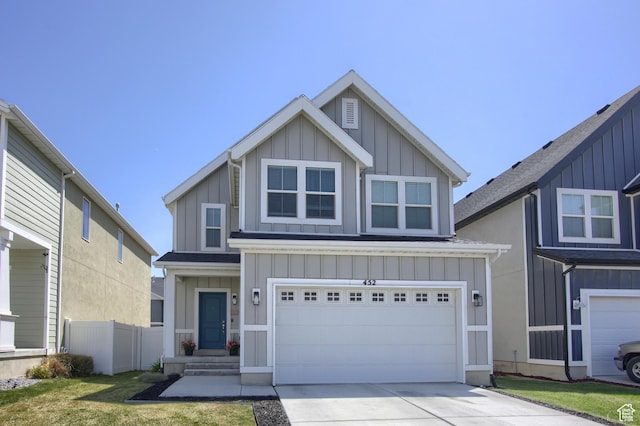 452 S Highpoint Dr, Saratoga Springs, UT 84045 - view of front facade featuring board and batten siding, a garage, driveway, and fence