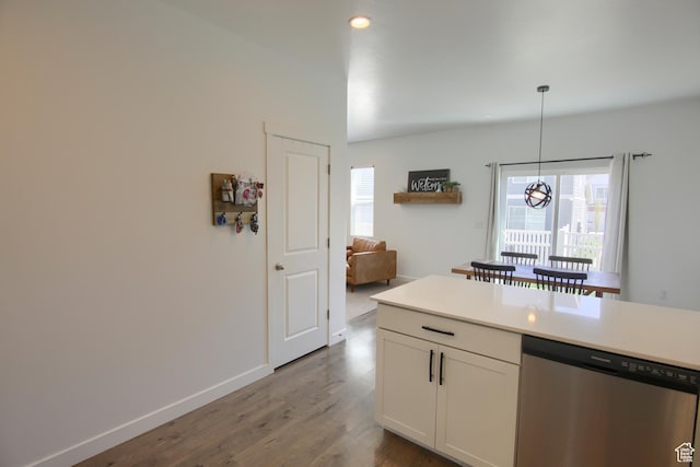 452 S Highpoint Dr, Saratoga Springs, UT 84045 - kitchen with pendant lighting, dishwasher, white cabinetry, dark wood-type flooring, and light countertops