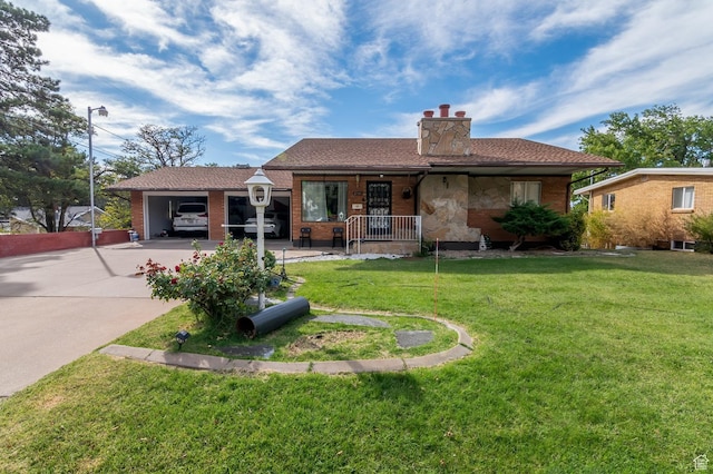 view of front facade with a porch, a front yard, a chimney, and driveway
