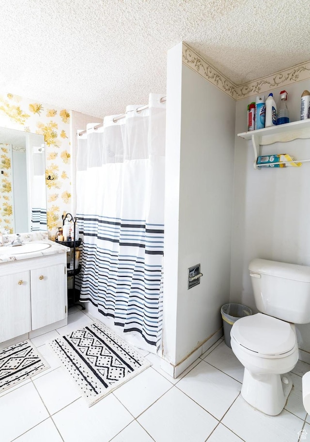 bathroom with toilet, wallpapered walls, a shower with shower curtain, a textured ceiling, and tile patterned flooring