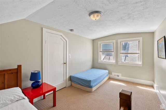 1159 S Windsor St, Salt Lake City, UT 84105 - carpeted bedroom with vaulted ceiling, a textured ceiling, baseboards, and visible vents