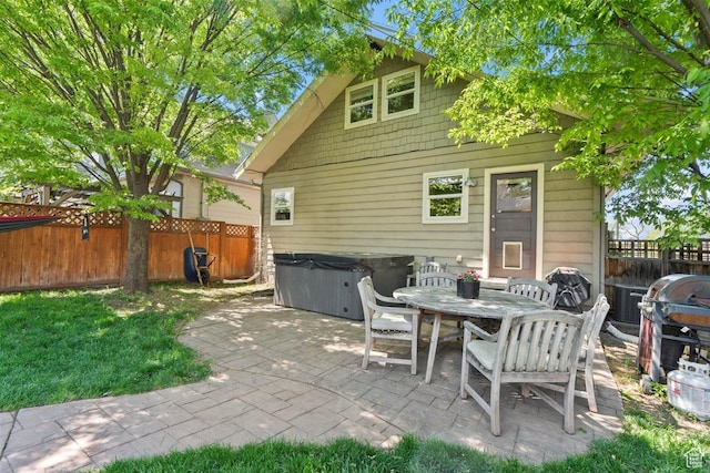 1159 S Windsor St, Salt Lake City, UT 84105 - view of patio / terrace featuring area for grilling, outdoor dining space, a hot tub, and a fenced backyard