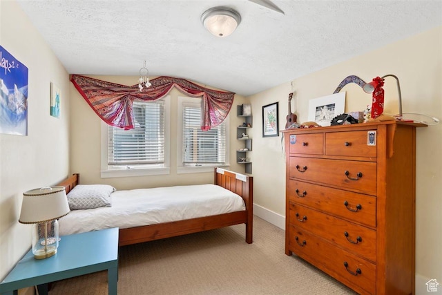 1159 S Windsor St, Salt Lake City, UT 84105 - bedroom featuring baseboards, light carpet, a textured ceiling, and vaulted ceiling