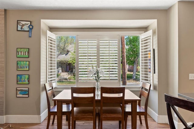 1159 S Windsor St, Salt Lake City, UT 84105 - dining room with a wealth of natural light, baseboards, and wood finished floors