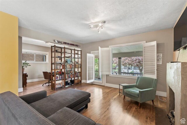 1159 S Windsor St, Salt Lake City, UT 84105 - sitting room featuring baseboards and wood finished floors