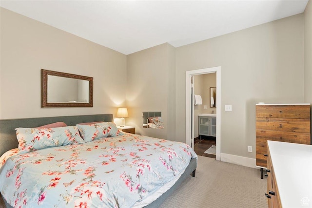 1159 S Windsor St, Salt Lake City, UT 84105 - bedroom with light carpet, connected bathroom, and baseboards