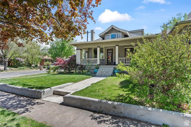 1159 S Windsor St, Salt Lake City, UT 84105 - view of front of home featuring a front yard and a porch