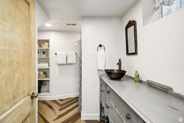 341 E E Blvd, Logan, UT 84321 - bathroom with vanity, baseboards, visible vents, and recessed lighting