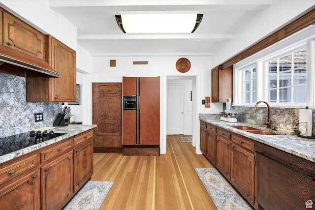 341 E E Blvd, Logan, UT 84321 - kitchen featuring a sink, light wood-type flooring, dishwashing machine, backsplash, and refrigerator with ice dispenser