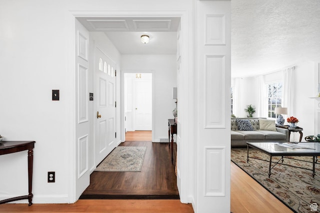 341 E E Blvd, Logan, UT 84321 - foyer entrance featuring wood finished floors and baseboards