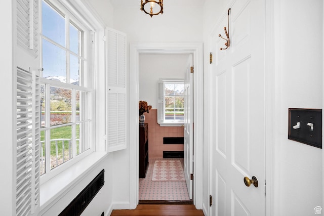 341 E E Blvd, Logan, UT 84321 - corridor featuring tile walls and dark wood-type flooring