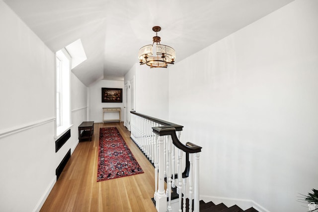 341 E E Blvd, Logan, UT 84321 - interior space featuring a notable chandelier, an upstairs landing, and light wood-type flooring