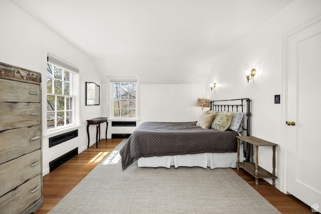 341 E E Blvd, Logan, UT 84321 - bedroom with vaulted ceiling and wood finished floors