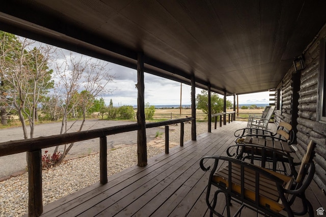 wooden deck featuring a view of rural / pastoral area