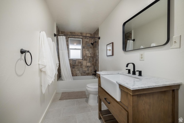 bathroom featuring tile patterned flooring, toilet, shower / bath combo with shower curtain, vanity, and baseboards