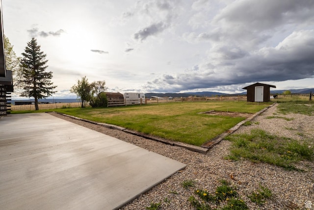 view of yard with a shed and an outbuilding