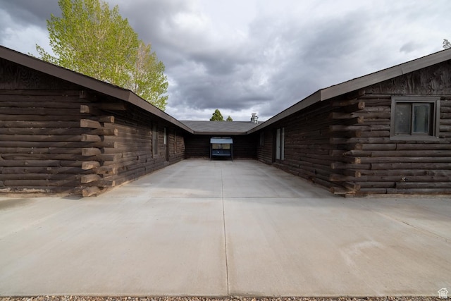 view of property exterior with log exterior