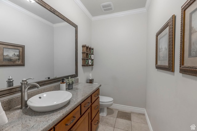 half bath with toilet, crown molding, visible vents, baseboards, and vanity