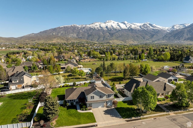 drone / aerial view featuring a residential view and a mountain view