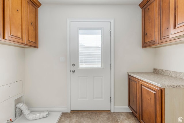 laundry area with cabinet space