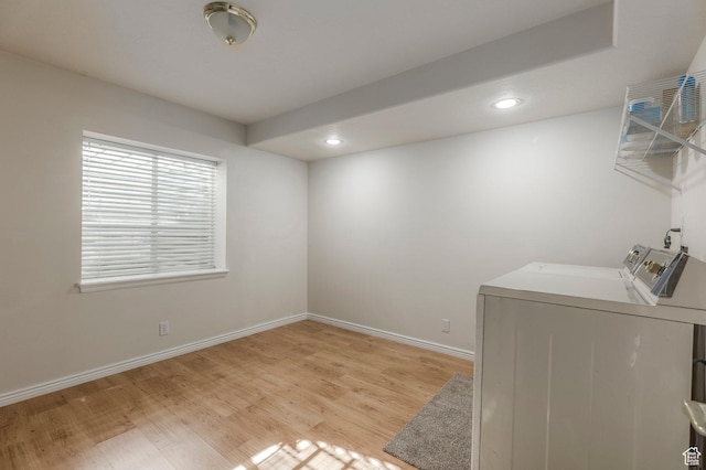 laundry room featuring recessed lighting, independent washer and dryer, light wood-type flooring, and laundry area