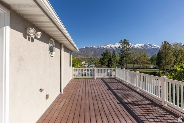 wooden terrace featuring a mountain view