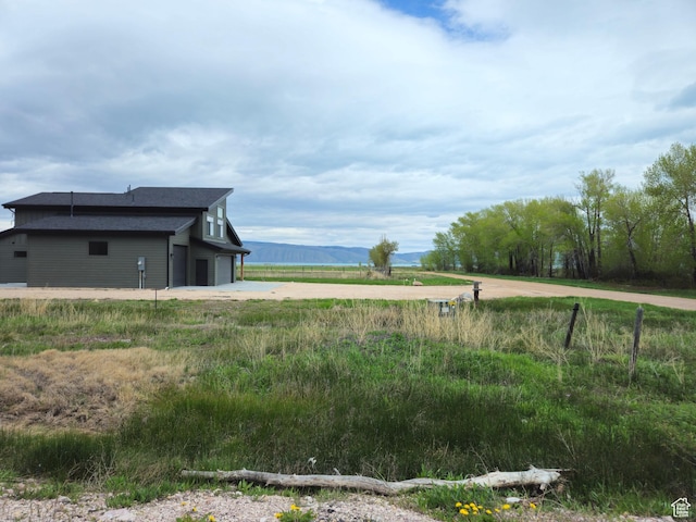 50 E 200 S, Saint Charles, ID 83272 - view of yard featuring driveway, a garage, and a view of rural / pastoral area
