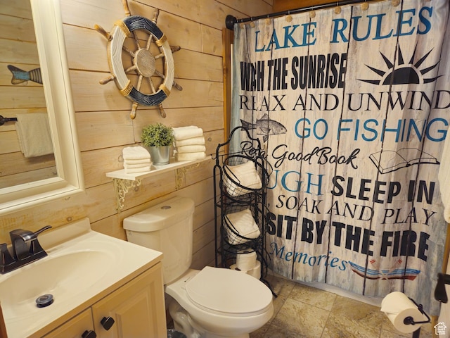50 E 200 S, Saint Charles, ID 83272 - full bathroom with wooden walls, toilet, vanity, and a shower with shower curtain