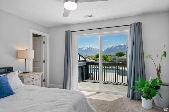 11549 S Equestrian Dr W, South Jordan, UT 84095 - bedroom with a mountain view, visible vents, ceiling fan, carpet floors, and access to exterior