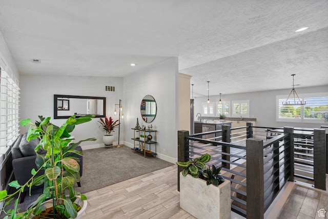 11549 S Equestrian Dr W, South Jordan, UT 84095 - hall featuring an upstairs landing, visible vents, recessed lighting, wood tiled floor, and baseboards