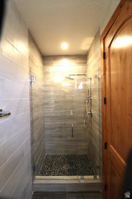 bathroom with a stall shower